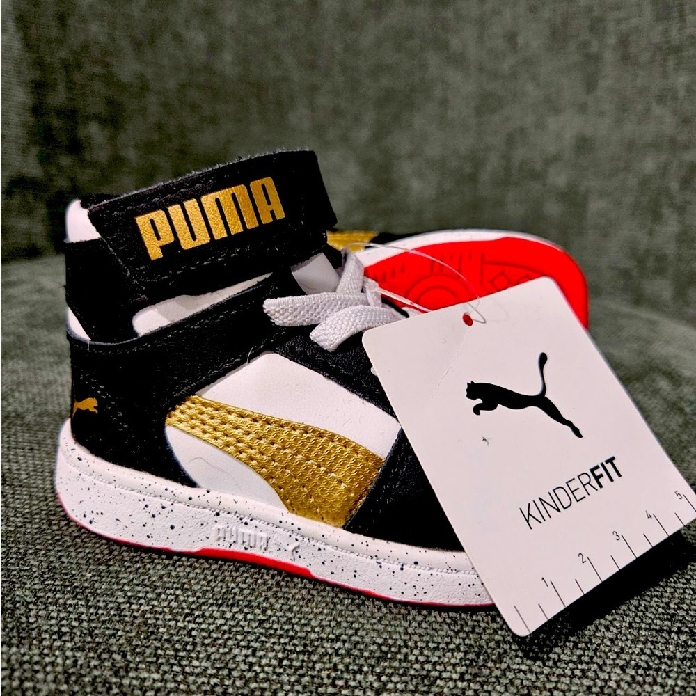 Toddler Puma rebound. black, red, gold. NEW. Size 4
